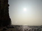 FZ012347 Llantwit Major cliffs during partial solar eclips.jpg